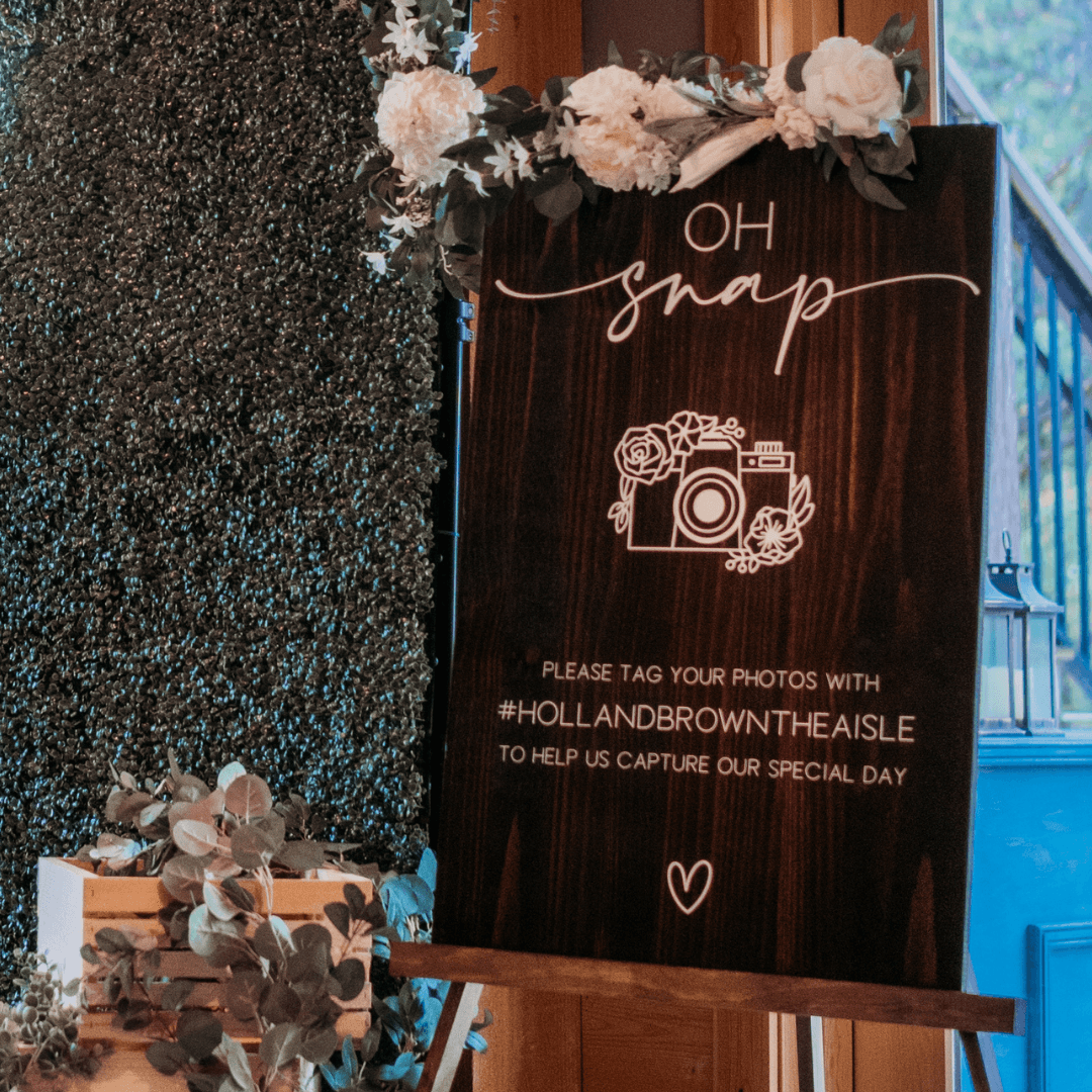 Greenery wall with Oh Snap sign
